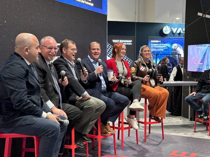 SpaceNews Senior Staff Writer Jeff Foust, third from left, moderates the Star Trek vs. Star Wars debate Thursday at Redwire’s booth during the 39th Space Symposium in Colorado Springs. Credit: Brian Berger/SpaceNews