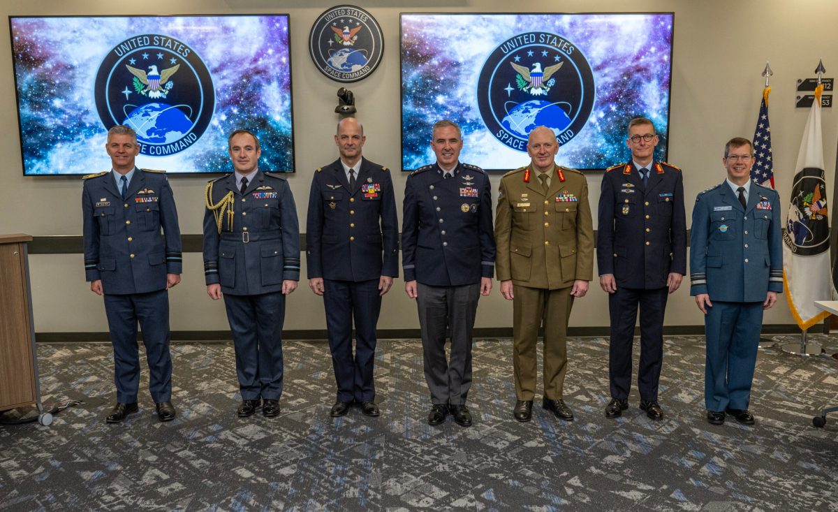 Photo of U.S. Space Force Gen. Stephen Whiting, U.S. Space Command commander (Center), standing with French Space Command Maj. Gen. Philippe Adam, French Air and Space Force space commander (Third from Left), and other senior leaders during a multilateral meeting about Operation Olympic Defender in Colorado Springs, Colorado on April 12, 2024.